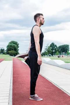Athlete preparing for training on running track Stock Photos