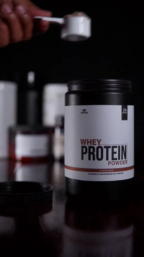 Athlete preparing a whey based drink for muscle recovery Video stock 330192478