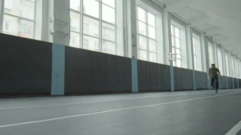 Athlete with Prosthetic Leg Running in Stadium Stock Footage 202012256
