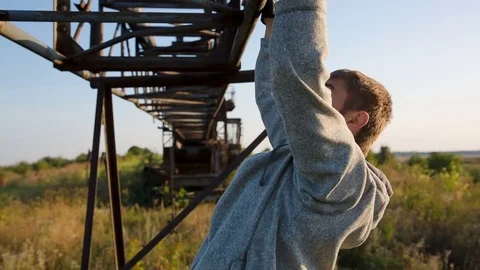 Athlete pulling up on morning exercise in the outdoors 스톡 동영상 79477888