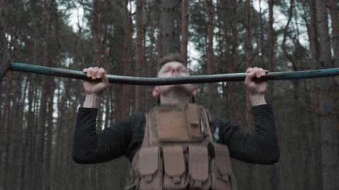 Athlete pulls up in the forrest Stock Footage 131092775