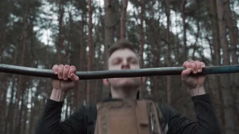 Athlete pulls up in the forrest Stock Footage 131092973