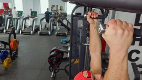 Athlete pulls himself up on the crossbar in the gym. Sports training, healthy Video stock 189951276