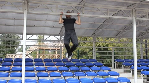 Athlete pulls on the university stadium Stock Footage 55791298