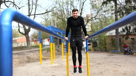 Athlete is Pushed on Bars Stock Footage 62236558