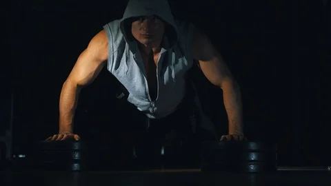 The athlete pushes, squeezes from the floor. Black background. Stock Footage 88548086