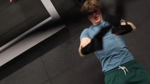 Athlete pushes through a challenging suspension training exercise Stock-Footage 339321585