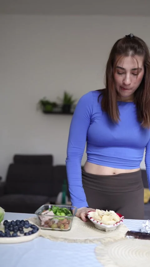 Athlete refuses to break her diet despite temptation. Stock Footage 339856091