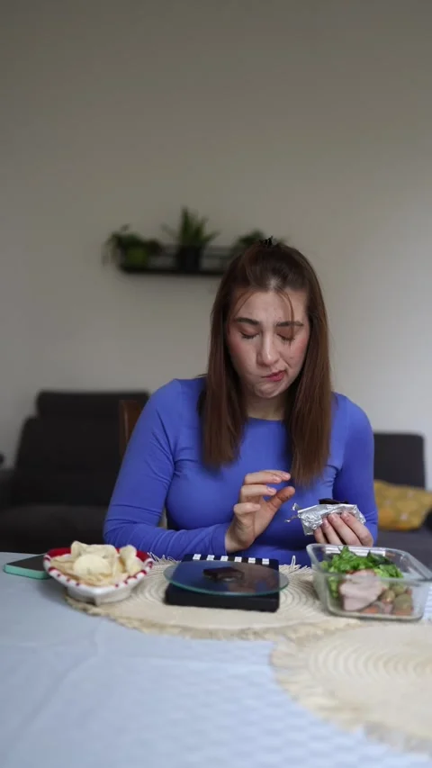 Athlete resists chocolate during strict diet Stock Footage 339854960