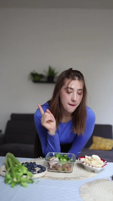 Athlete resists eating chips during a diet. Stock Footage 339856213