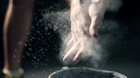 A athlete is rubbing magnesia on hands and clapping. Close up of male boxer Video stock 156980037