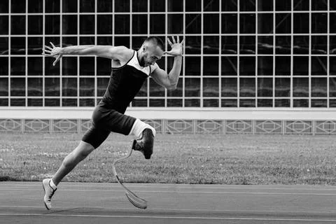 Athlete runner disabled run on track black and white photo Stock Photos