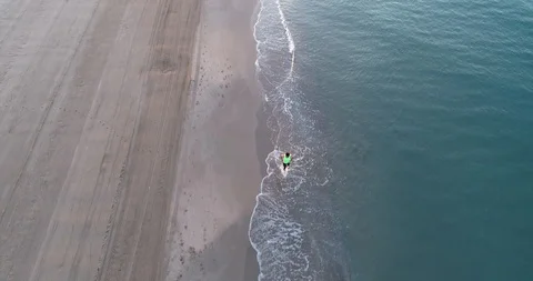 Athlete running on the beach Stock Footage 101098189