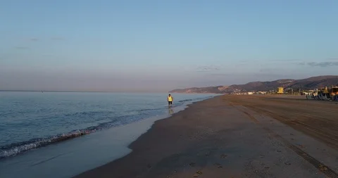 Athlete running on the beach Stock Footage 101098247
