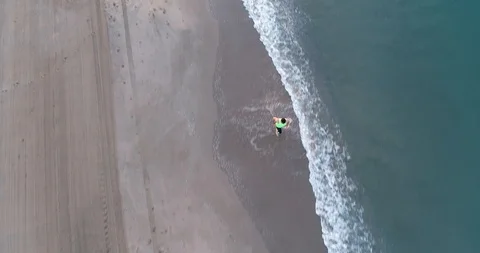 Athlete running on the beach Stock Footage 101098250