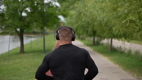 An athlete Running in the Park Stock Footage 249917246