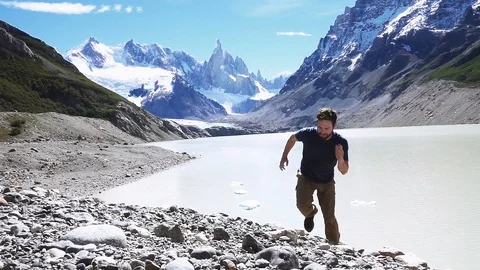 Athlete running on the slopes of the mountain Stock Footage 116663680