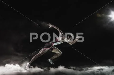 Athlete running in the smoke Stock Photos