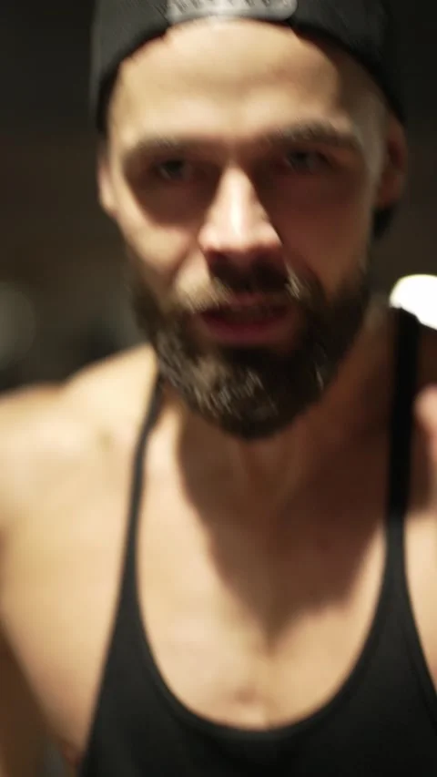 An athlete running on a treadmill has difficulty breathing Stock Footage 224316390