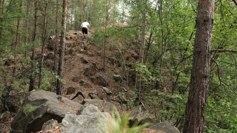 An athlete runs into a high mountain Video stock 246937247