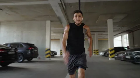 Athlete runs really fast inside the parking garage 스톡 동영상 159815675