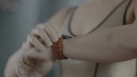 Athlete sets clock for exercise Stock Footage 146177258