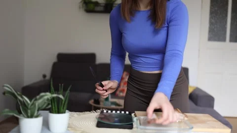 Athlete slices chicken for precise meal portions. Stock Footage 339856498