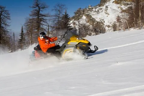 Athlete on a snowmobile Stock Photos