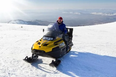 Athlete on a snowmobile Stock Photos