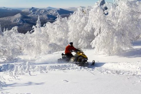 Athlete on a snowmobile Stock Photos