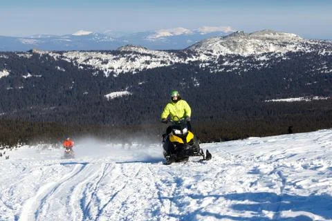Athlete on a snowmobile Stock Photos