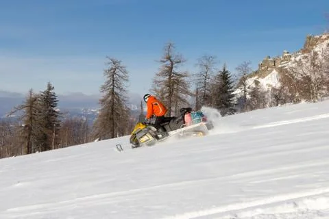Athlete on a snowmobile. Stock Photos