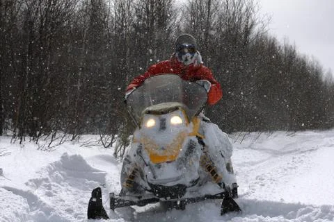 Athlete on a snowmobile. Stock Photos