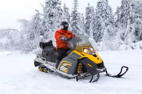 Athlete on a snowmobile. Stock Photos