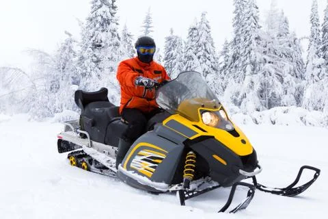Athlete on a snowmobile. Stock Photos