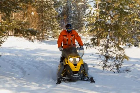 Athlete on a snowmobile. Stock Photos