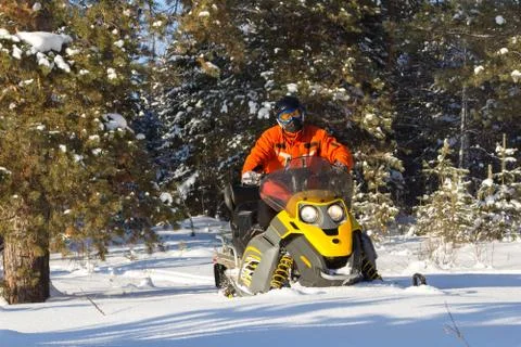 Athlete on a snowmobile. Stock Photos