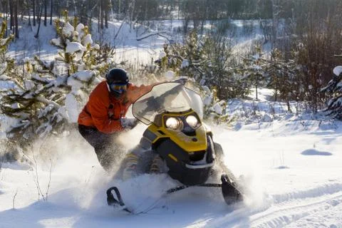 Athlete on a snowmobile. Stock Photos