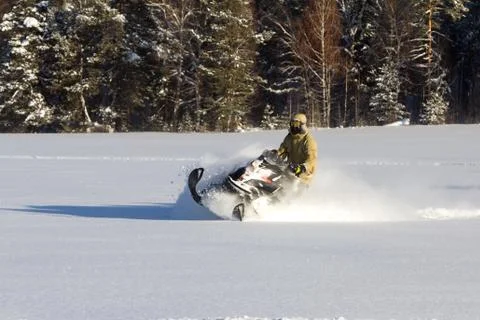 Athlete on a snowmobile Stock Photos