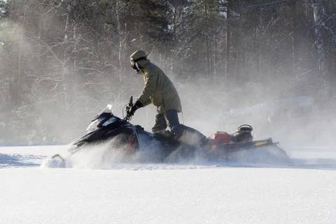 Athlete on a snowmobile. Stock Photos