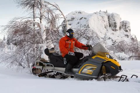 Athlete on a snowmobile Stock Photos