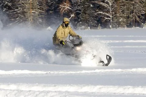 Athlete on a snowmobile. Stock Photos