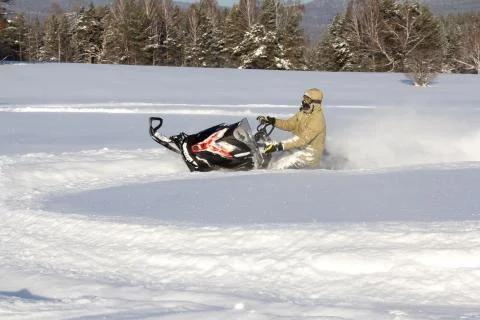 Athlete on a snowmobile Stock Photos