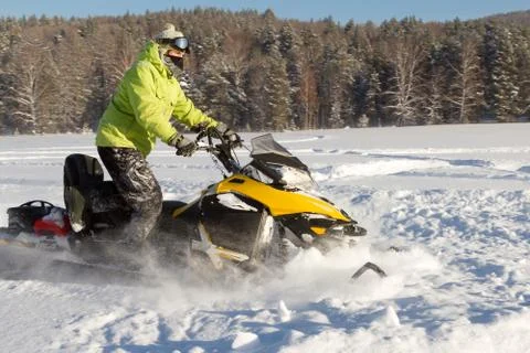 Athlete on a snowmobile. Stock Photos