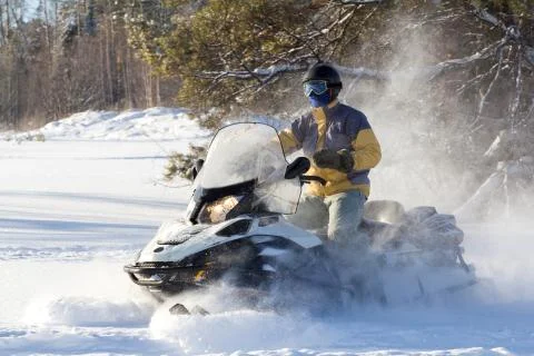 Athlete on a snowmobile. Stock Photos