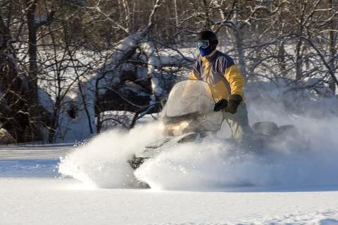 Athlete on a snowmobile. Stock Photos