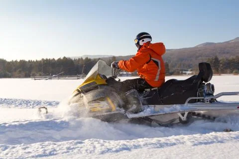 Athlete on a snowmobile. Stock Photos