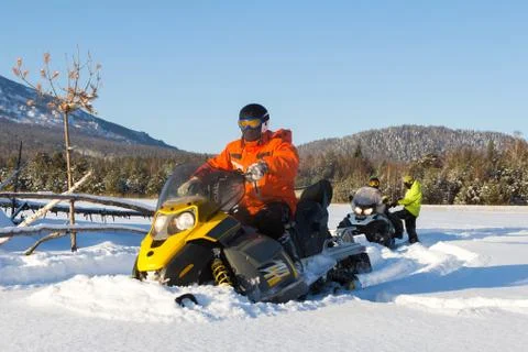 Athlete on a snowmobile. Stock Photos