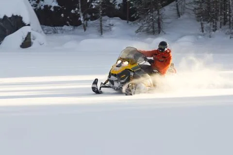 Athlete on a snowmobile. Stock Photos