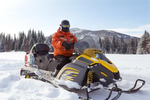 Athlete on a snowmobile. Stock Photos